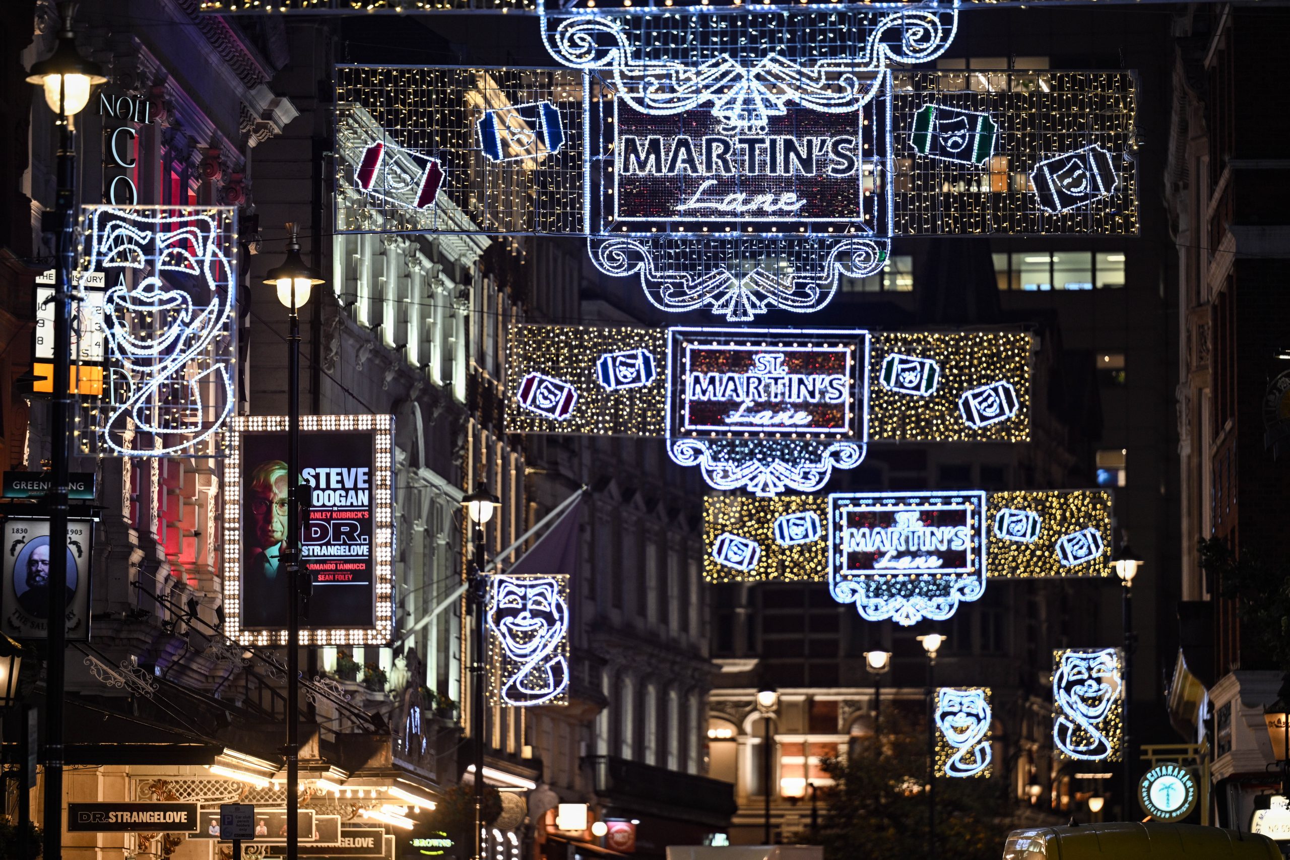 Christmas lights on St Martin's Lane. Christmas shopping in Covent Garden.