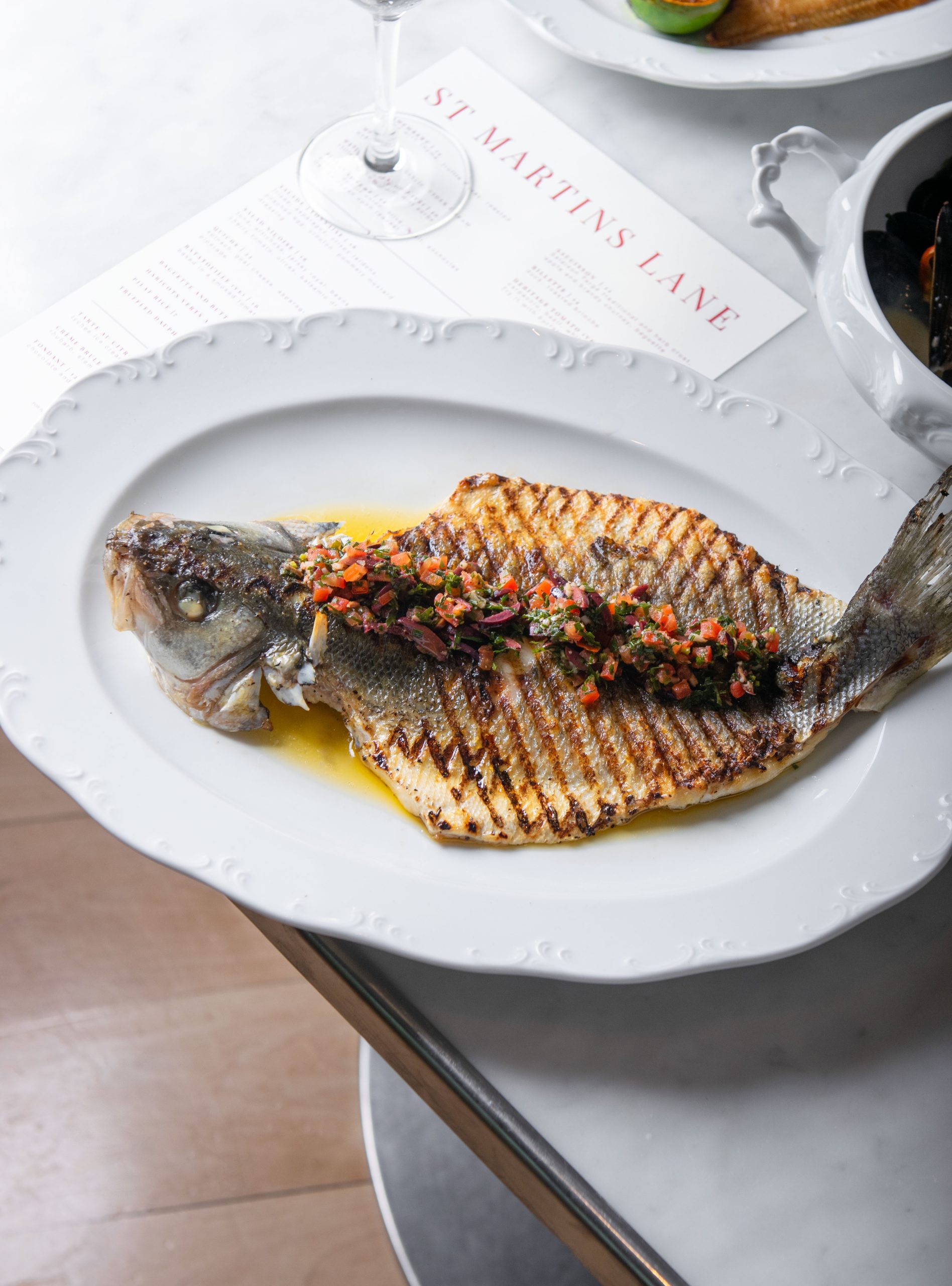 Summer Menu French Inspired at the Restaurant. Butterflied Seabass.