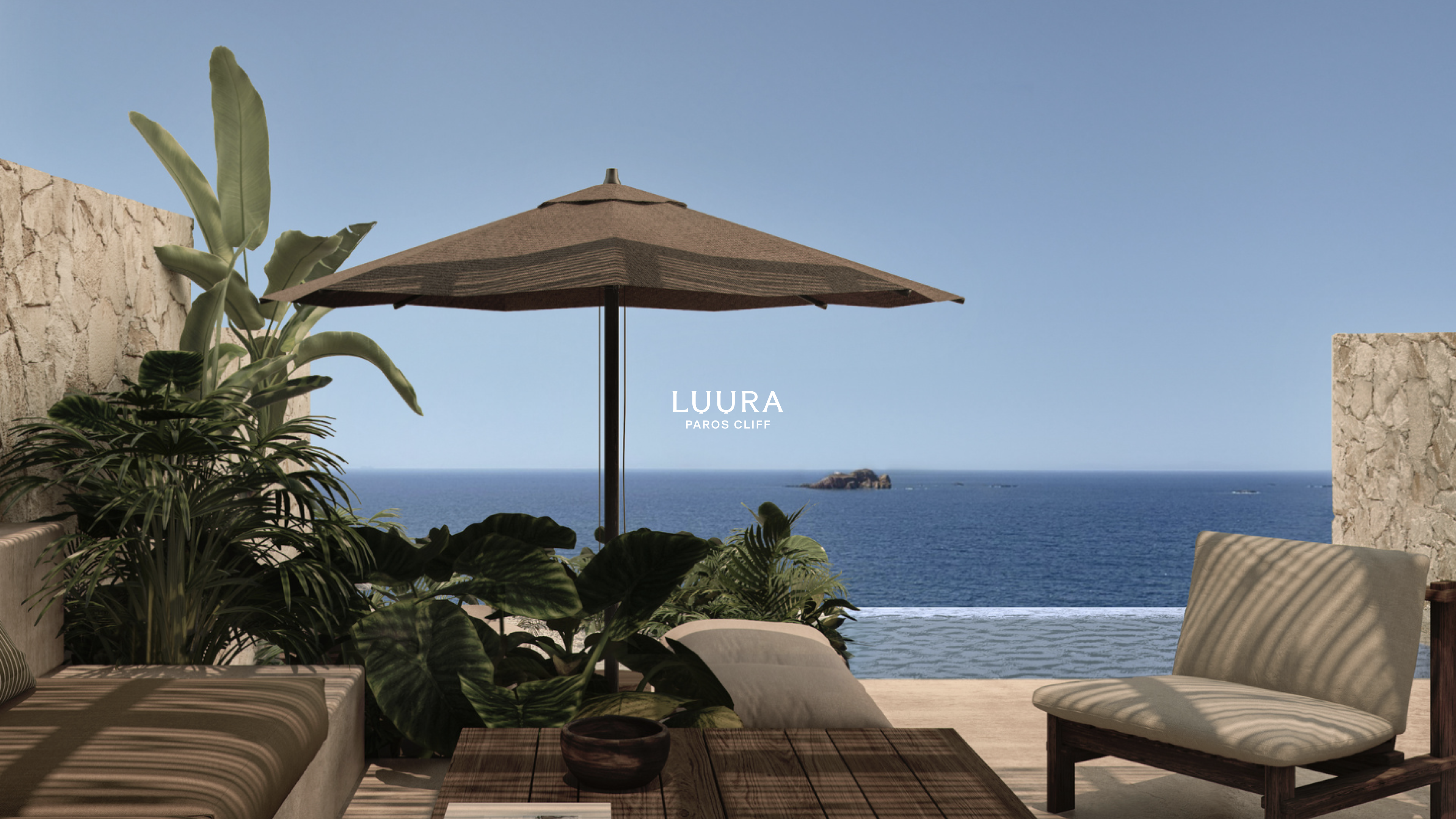 Terrace of suite looking out to the sea with a sunken sofa and parasol
