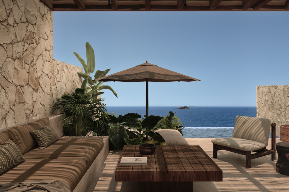 Une terrasse chaleureuse avec un canapé en lin, un fauteuil et une table basse en bois, face à la piscine.